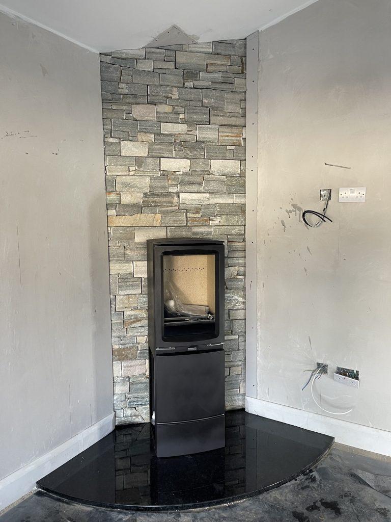 Custom curved black granite hearth with 47 inch radius, CNC cut and polished, with a Stovax Vogue Midi T stove and twin wall flue, Co. Meath