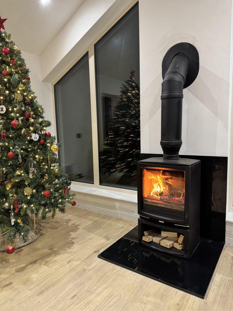 Stovax Vogue stove with black granite hearth and back panel